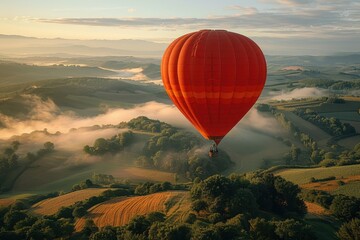 Wall Mural - A majestic hot air balloon floating over a picturesque landscape of rolling hills and fields at dawn. 