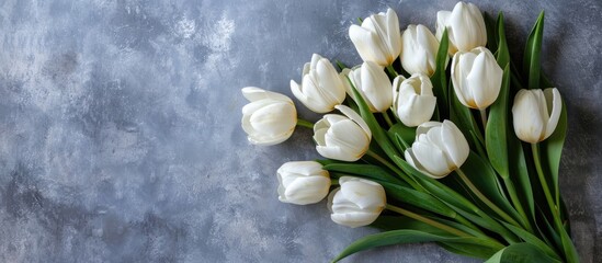 Aufkleber - White tulips arranged in a bouquet against a gray backdrop, a perfect gift with a feminine touch, symbolizing a celebration for women with copy space image.