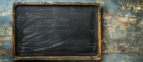 Poster - Blackboard with chalk traces on an empty surface for writing. Retro school board with a black texture, ideal for a copy space image.