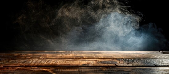 Fototapete - A dark background showcases an empty wooden table with smoke rising, providing copy space image for product display.