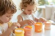 © Ryzhkov - Young Girl and Boy Choosing Vitamin Discs in Bright Kitchen Interest in New Vitamin Formats