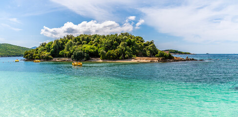 Wall Mural - A view towards a group of islands offshore from the beach at Ksamil, Albania in summertime