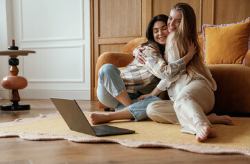 Happy playful free moments. Two young female best friends are indoors