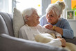 © pikselstock - Elderly woman with her caregiver at nursing home