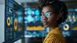 © Neat Design Studio - Portrait of a black African American woman data analyst standing in front of multiple screens with charts and graphs with data