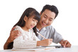 © aekkorn - Children education and home school concept : Young asisn father pleased to see little daughters' study success. Excited smiling small child girl enjoying learning and writing on white background.