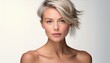 © Roberto - studio portrait of a blonde short haired woman with nude shoulders on white background