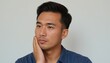 © Eliane - Seeking Solutions: Asian Man Contemplates His Next Move