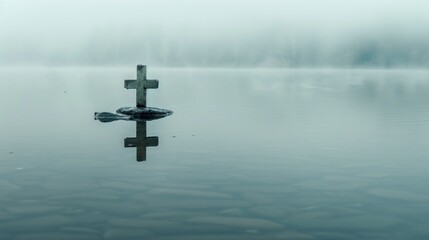 Wall Mural - cross in the middle of a calm lake with a little fog