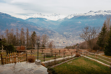 Wall Mural - City of Aosta from above with mountains behind