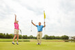 © Reese Coop/peopleimages.com - Mature couple, celebrate and golf success outdoor for winning score, achievement and competition victory. Happy, people and winner, tee stroke and target challenge on grass field of recreation hobby