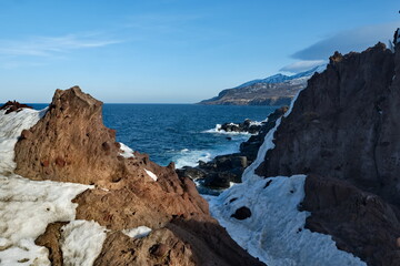 Poster - Russia. Far East, Kuril Islands. Very hard and sharp basalt rocks along the coast of the Sea of Okhotsk on the island of Iturup.