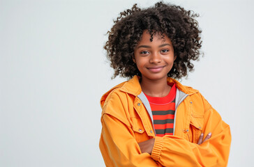 Wall Mural - Black girl with voluminous hair smiling friendly with arms crossed on white background Generative AI