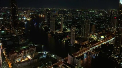 Wall Mural - Bangkok BKK the city that never sleeps colourful lights of the buildings shops streets cars of the city and urban skyline view from one of the tallest Sky Tower in BKK 