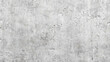 © Roman - A close-up shot of a gray concrete wall with a rough texture