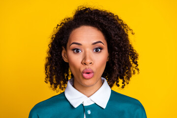 Wall Mural - Photo of adorable stunned woman with perming coiffure dressed stylish shirt staring pouted lips isolated on yellow color background