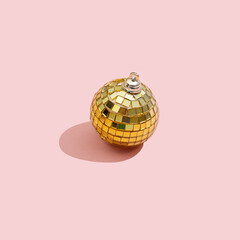 Wall Mural - Festive bauble on pink background