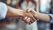 © Maxim Borbut - Businesswoman shaking hands at a meeting, highlights professional relationships