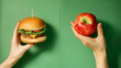 © WETDREAM - Two people holding a hamburger and an apple