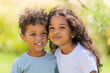 © Tina kids photo - small mulatto children a boy and a girl on a summer walk