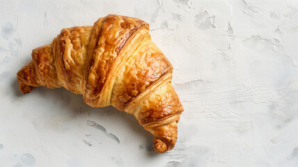 Beautifully Golden Croissant With Flaky Layers On A Light White Background