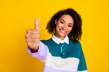 Wall Mural - Photo of gorgeous lovely woman with perming coiffure dressed stylish shirt show you thumb up good job isolated on yellow color background