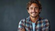 © Maxim Borbut - Young handsome smiling man with folded arms. Happy joyful smiley man with crossed hands. Isolated on gray background.