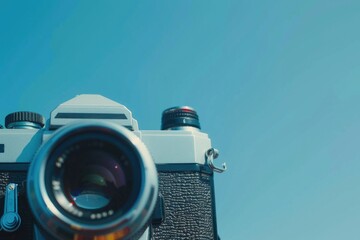 Aufkleber - A detailed view of a camera with a blue sky in the background, suitable for use as a symbol or icon