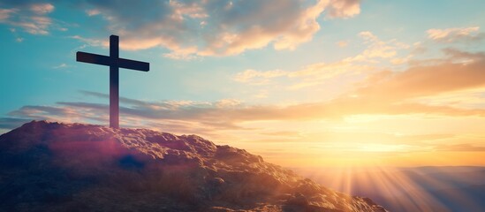 The cross on the hill. The cross of Christ over the hill in the sunset. Jesus Christ saving us. Salvation and Easter concept.
