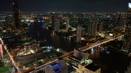 Wall Mural - Bangkok BKK the city that never sleeps colourful lights of the buildings shops streets cars of the city and urban skyline view from one of the tallest Sky Tower in BKK 