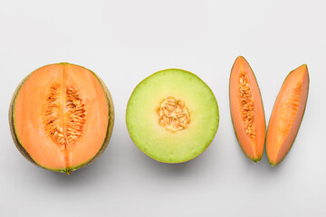 Wall Mural - Tasty ripe melons on white background