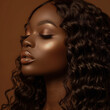 © K Love Studios - portrait of a melanin woman with glowing brown skin and gold glam makeup