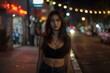 © blvdone - Sexy Hispanic woman standing on a city street at night