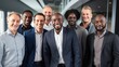 © CStock - Group of multiethnic businessmen standing together in an office environment, smiling confidently