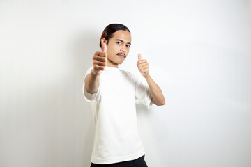 Young man wearing a white t-shirt. make okay movements with his hands. sign isolated on white background