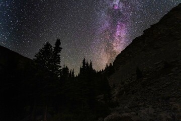 Wall Mural - night landscapes with beautiful starry sky and the milky way against the backdrop of a mountain lake