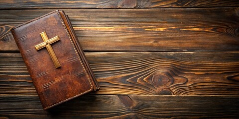 Wall Mural - Worn brown leather Holy Bible with gold cross on wooden background, religious, scriptures, Christianity, faith