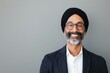 © mariiaplo - Cheerful Sikh Man Wearing Traditional Turban and Modern Business Attire