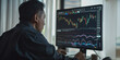 © Mr. Stocker - Financial specialist analyzing stock market data on computer