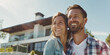 © 1005mm photography - Happy European married couple smiling in front of their own home