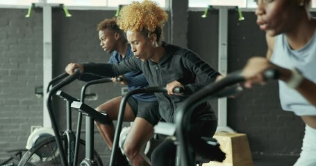 Poster - Gym, woman and group on bike, fitness and exercise with energy and machine for cardio in morning and active. Action, moving and workout of people, training and wellness with cycling, speed and class