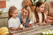 © Valerii Apetroaiei - Spending Time Together Mother and Daughters Enjoying Cooking Experience in the Kitchen