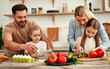 © Valerii Apetroaiei - Family cooking together in modern kitchen, enjoying meal preparation and quality time