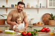 © Valerii Apetroaiei - Father and daughter bonding while cooking with fresh ingredients in the kitchen