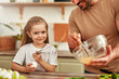 © Valerii Apetroaiei - Father and daughter bonding while cooking with fresh ingredients in the kitchen