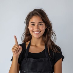 Wall Mural - A smiling woman in an apron pointing up.