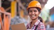 © Sirichat. Camphol - Female engineer worker, happy Asian working woman smiling in heavy industrial machinery factory Indian female engineer working with documents at prefabricated work site