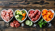 © Oleksiy - healthy fresh ingredients for pet food in individual heart-shaped bowls viewed from overhead with chopped raw beef, liver and chicken , mixed vegetables and rains on rustic wood