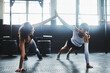 © peopleimages.com - Exercise, high five and push up with women on gym floor for power, strength training or workout. Fitness, smile and wellness with happy friends in health or sports center for motivation and support