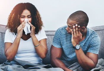 Wall Mural - frustrated couple, sick and argument with fight on sofa in disagreement, conflict or allergies at ho